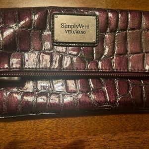 Wine-ish color Crocodile Clutch style wallet.